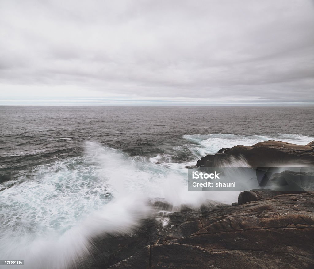 Overcast Surfscape Heavy surf pounds the Atlantic coast of Nova Scotia near Peggy's Cove. 2015 Stock Photo