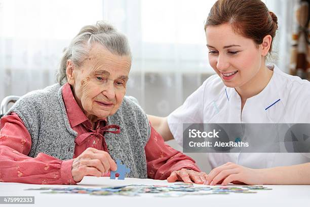 Senior Woman With Her Caregiver Stock Photo - Download Image Now - Senior Adult, Resting, Community Outreach