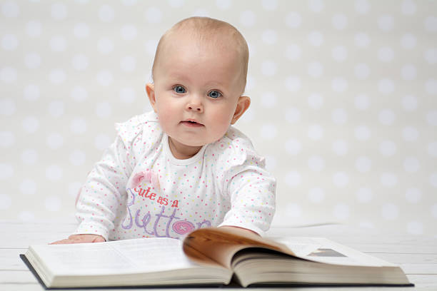 Baby with the book stock photo