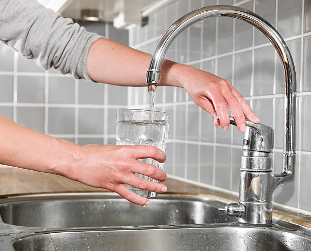istock Filling a glass of water 475992665