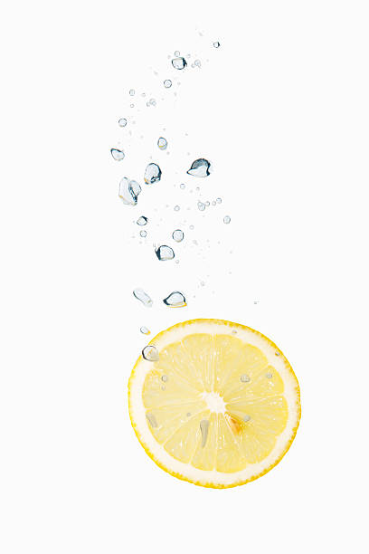 istock Lemon in water with air bubbles 475992893