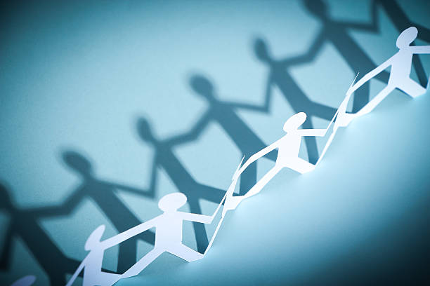 istock Group of people holding hands 475992918