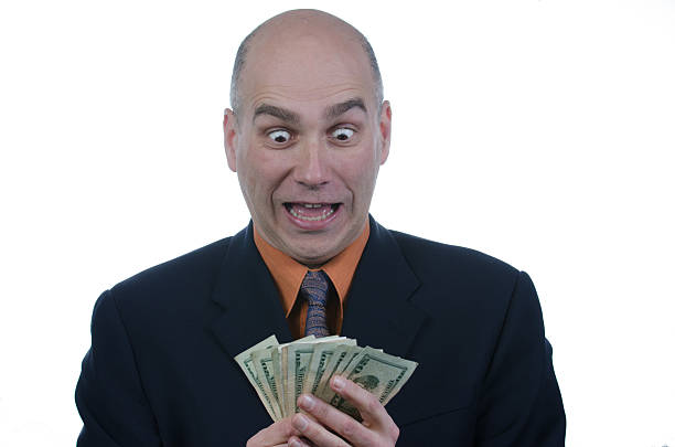 istock Man looking at US money with facial surprised expression 475994093