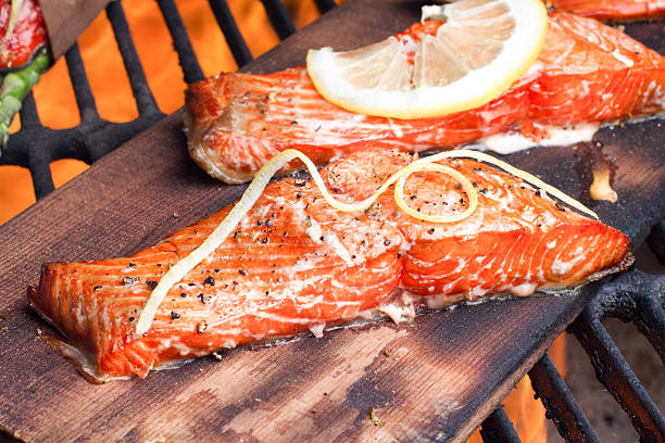 istock Cedar Plank Salmon Filets on a Barbecue Grill 475996074
