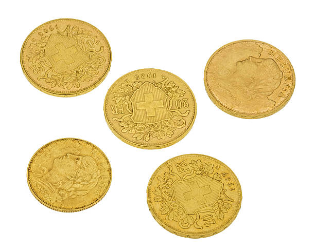 istock Swiss gold coins isolated on white 475998080