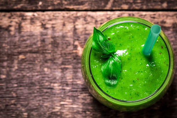 istock green Detox smoothie on wooden table 475998554
