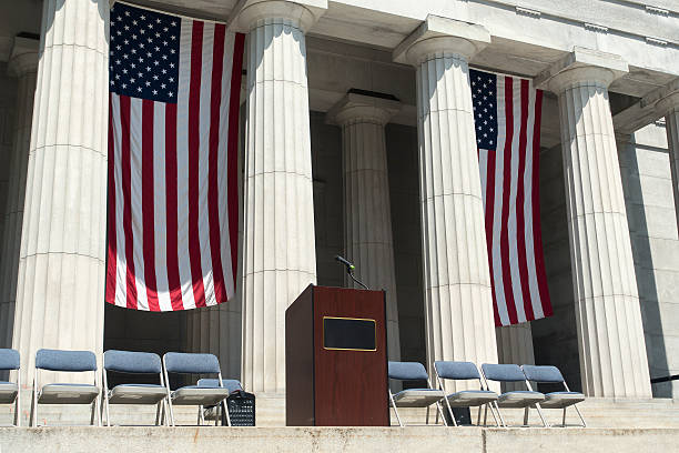 American flags behind podium stock photo