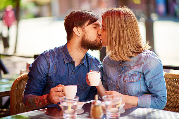 istock Kissing on coffee date 476001510