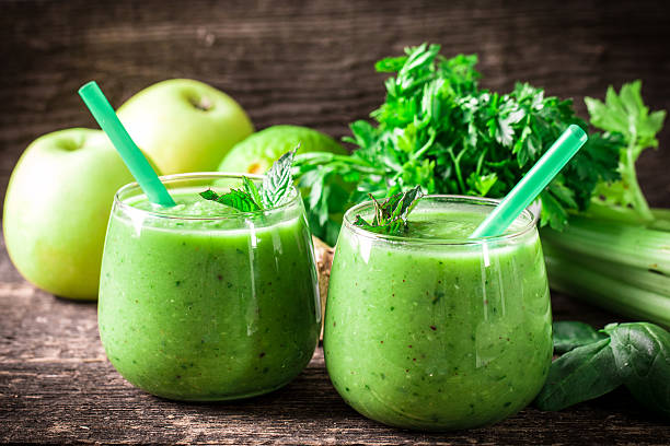 istock green Detox smoothie on wooden table 476005326