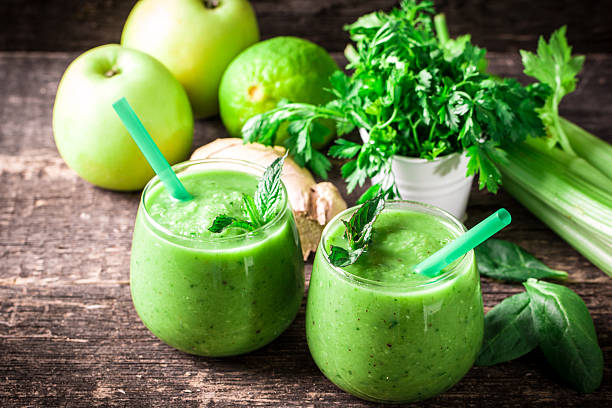 istock green Detox smoothie on wooden table 476005358