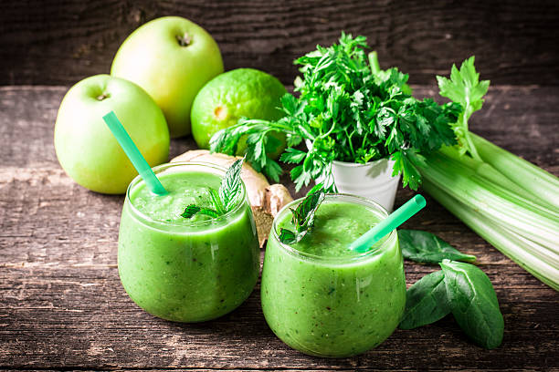 istock green Detox smoothie on wooden table 476005406
