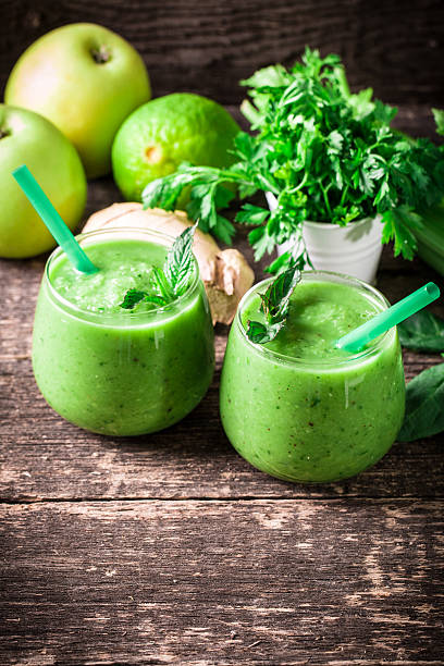 istock green Detox smoothie on wooden table 476005482