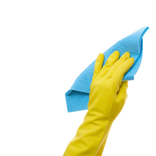 Hand in rubber glove with sponge isolated on white stock photo