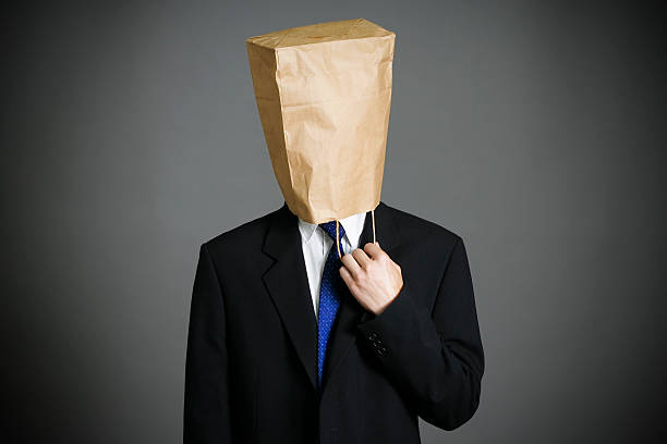 istock Businessman with a paper bag on head 476009252