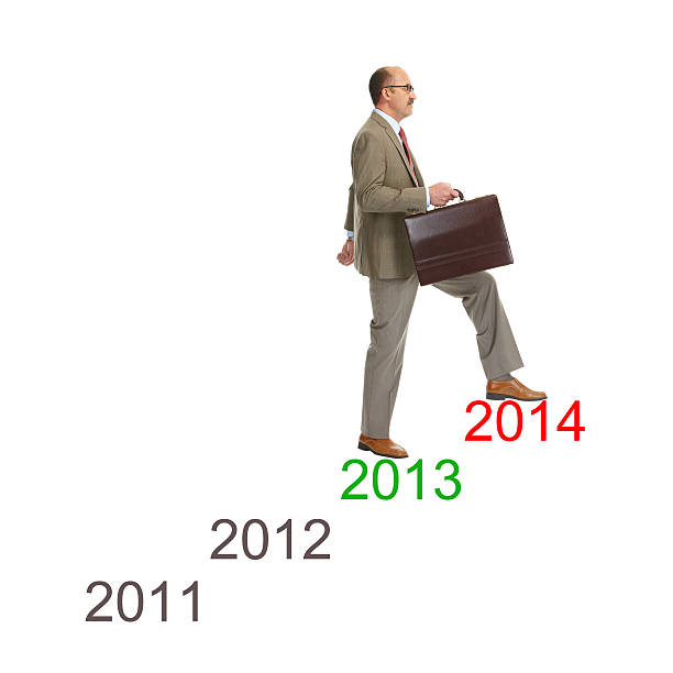 Advancement. Businessman walking on drawing stairs stock photo