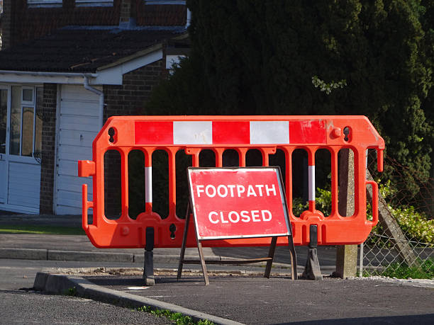 istock Image of 'Footpath Closed Sign' on pavement / road, resurfacing work 476010912