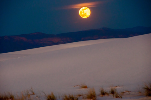 This full moon (Strawberry Moon) casts a magical glow at night over White Sands National Monument, New Mexico in early June 2015. Strawberry Moon is one name for the first full moon of June, which is a signal to begin harvest of fruits such as berries. Another name for June's first full moon is Rose Moon.