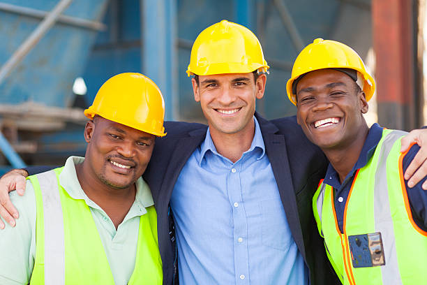 istock happy heavy industry manager and workers 476011347