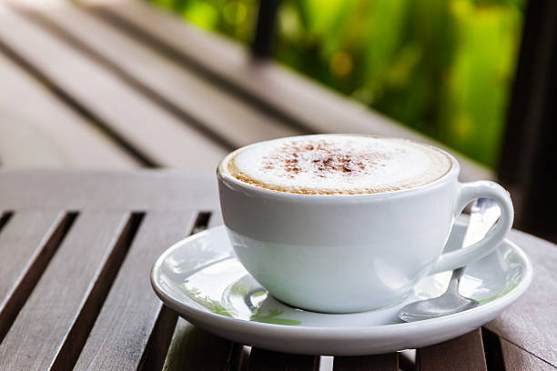 istock Cappuccino or latte coffee on wooden table. 476014386
