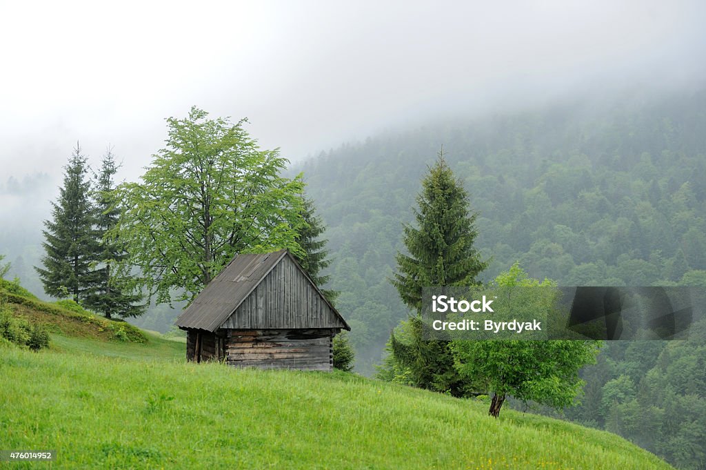 Old house in mountain An old house and fog in mountain. Summer day 2015 Stock Photo