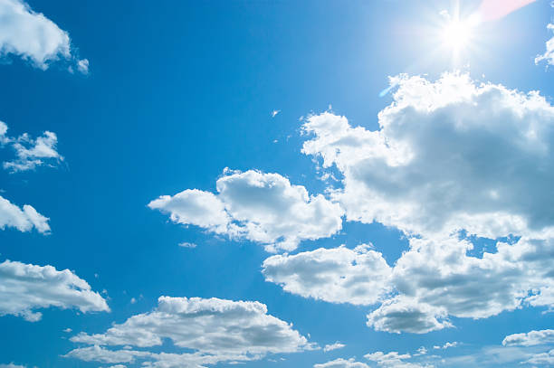 istock beautiful blue sky with clouds and sun 476015318