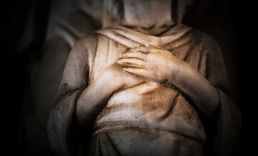 Staglieno, Genoa, Italy - June 22, 2021: Monumental Cemetery. Statue, sculpture. Portrait, close-up of a woman taken in a monumental cemetery.