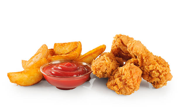 istock Fried chicken wings potatoes and ketchup 476021002