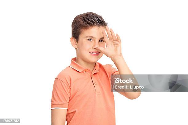 Silly Little Boy Making A Childish Hand Gesture Stock Photo - Download Image Now - 2015, Boys, Brat