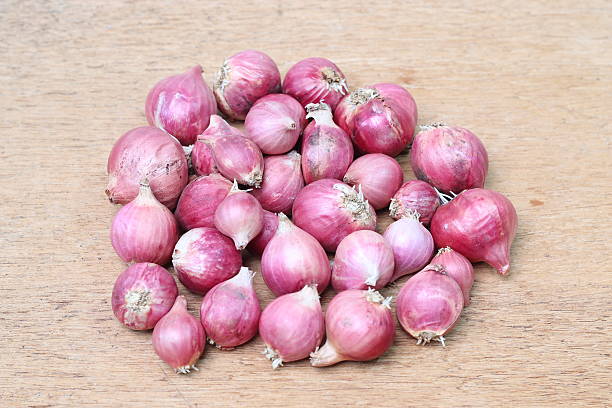 istock Shallot onions a group on wood 476021800