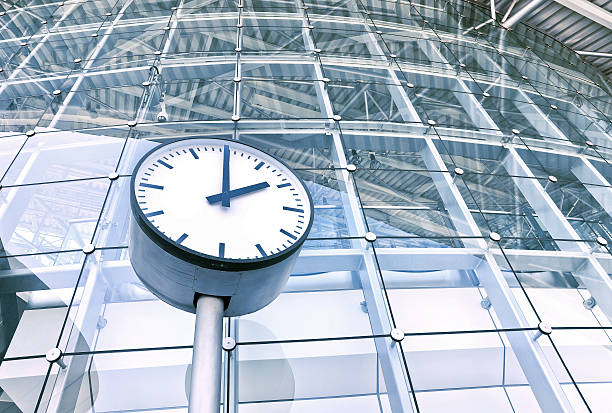 istock Clock in front of an office building 476021840
