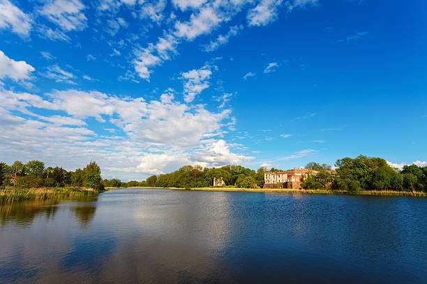 istock Old castle by the lake under blue sky 476021960