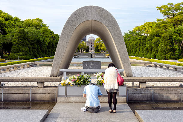The Hiroshima Peace Memorial (広島平和記念碑, Hiroshima Heiwa Kinenhi), originally the Hiroshima Prefectural Industrial Promotion Hall, and now commonly called the Genbaku Dome, Atomic Bomb Dome or A-Bomb Dome (原爆ドーム, Genbaku Dōmu), is part of the Hiroshima Peace Memorial Park in Hiroshima, Japan and was designated a UNESCO World Heritage Site in 1996.\nThe building was the only structure that remained standing in the area around the atomic bombing of Hiroshima at the end of World War II. The ruin of the hall serves as a memorial to the over 140,000 people who were killed in the bombing. It is permanently kept in a state of preserved ruin as a reminder of the destructive effects of nuclear warfare.