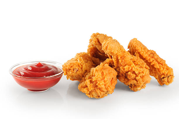 istock Fried in batter chicken wings and ketchup 476022214