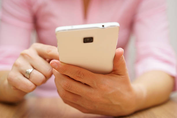 istock woman is typing on touch screen on mobile phone 476027006