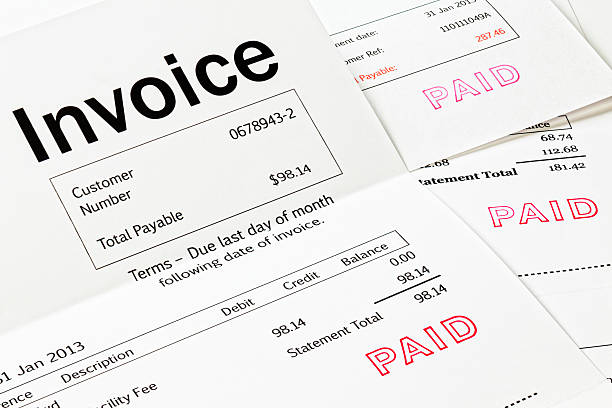 Invoice with Paid Stamp stock photo