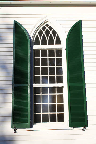 istock Church Window with Green Shutters 476029905