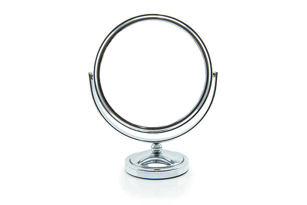 Old silver makeup mirror isolated on white Old silver makeup mirror isolated on white mirror object stock pictures, royalty-free photos & images