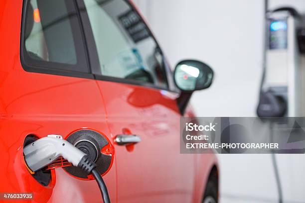 Parking Garage For Electric Vehicles Stock Photo - Download Image Now - Charging, Electric Vehicle, Red