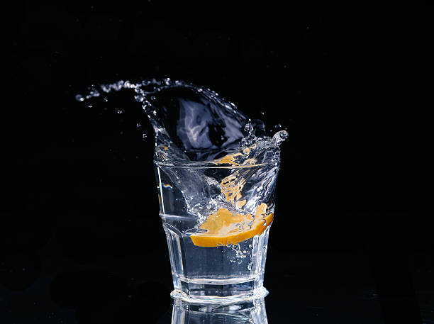 istock water on a glass on dark background. 476037414