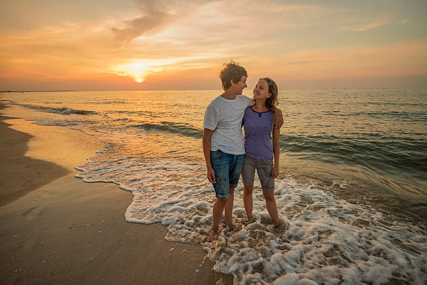 istock Boy and girl on the beach 476037660
