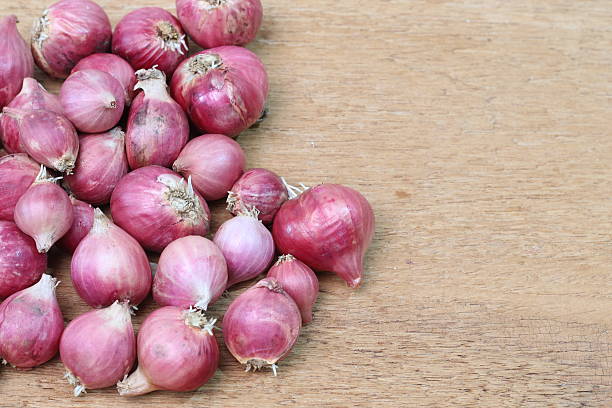 istock Shallot onions a group on wood 476037696