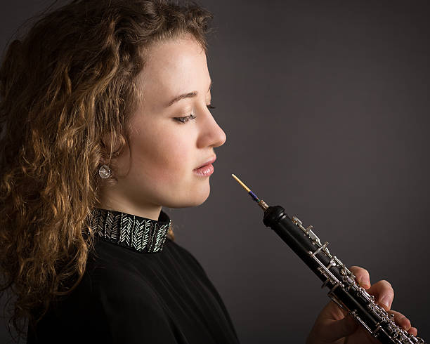 istock Beautiful Young Female Oboe Player 476038288