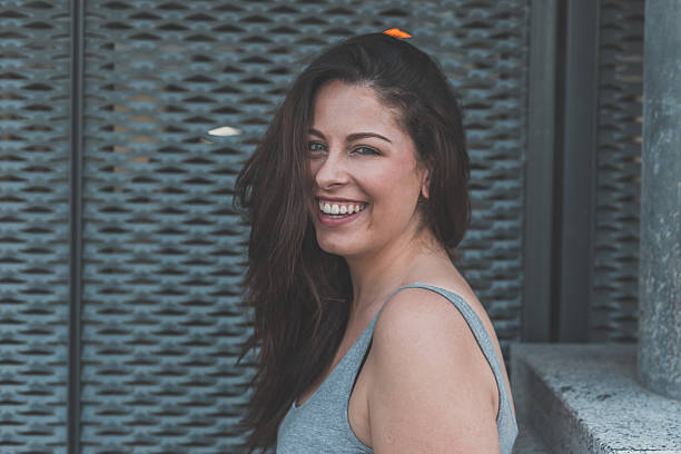 istock Beautiful curvy girl posing in an urban context 476038756