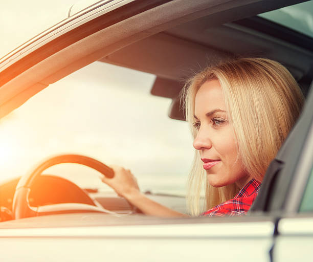 istock Young woman drive a car 476039916
