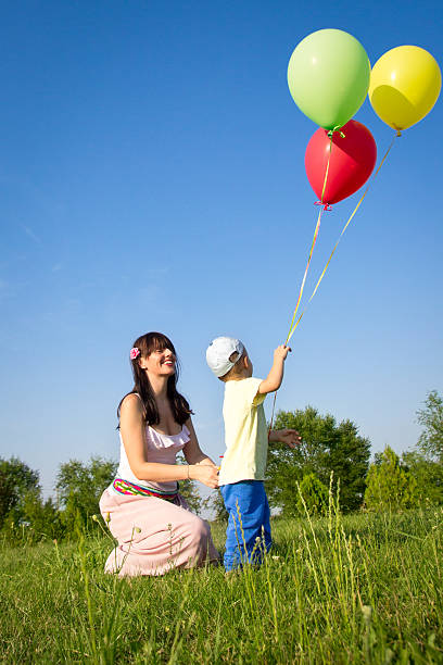 istock Mother and son playing with balloons 476039945