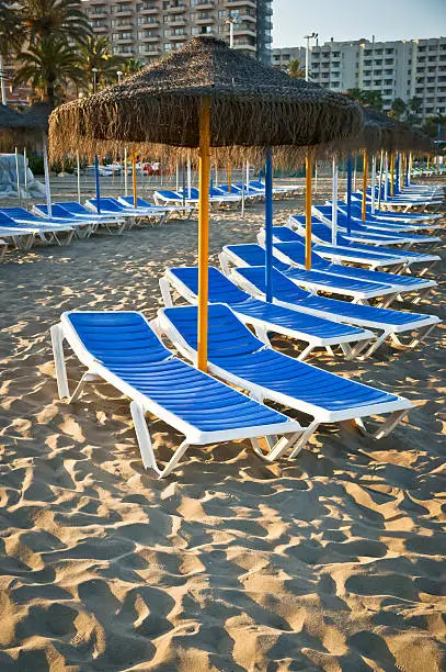 Photo of Sun loungers on a beach in Torremolinos, Malaga, Spain