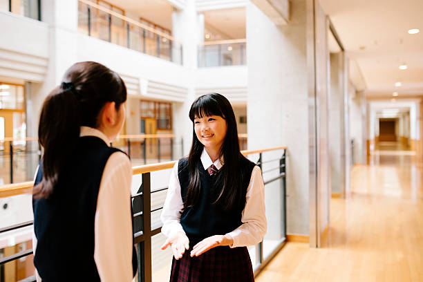 istock Japanese high school. Students chat, first floor corridor, overlooking atrium 476040848