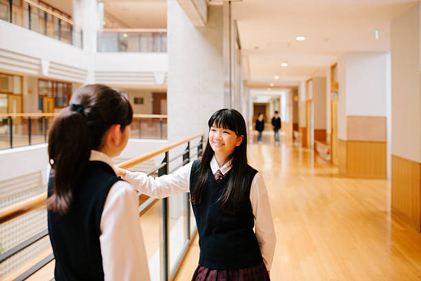 istock Japanese high school. Students chat, first floor corridor, overlooking atrium 476040850