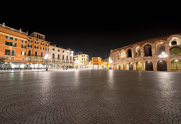 Piazza Bra and Arena by Night - Verona Italy Piazza Bra and Arena of Verona at night - Roman amphitheater verona opera stock pictures, royalty-free photos & images