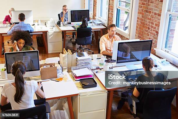 Wide Angle View Of Busy Design Office Stock Photo - Download Image Now - Office, Open Plan, Crowded